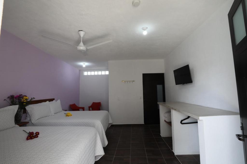 Postel nebo postele na pokoji v ubytování Hotel Del Mar