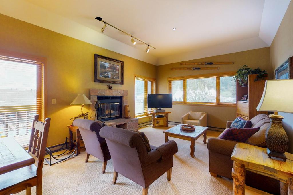 a living room with a couch and a tv at Purgatory Village #305 in Durango Mountain Resort