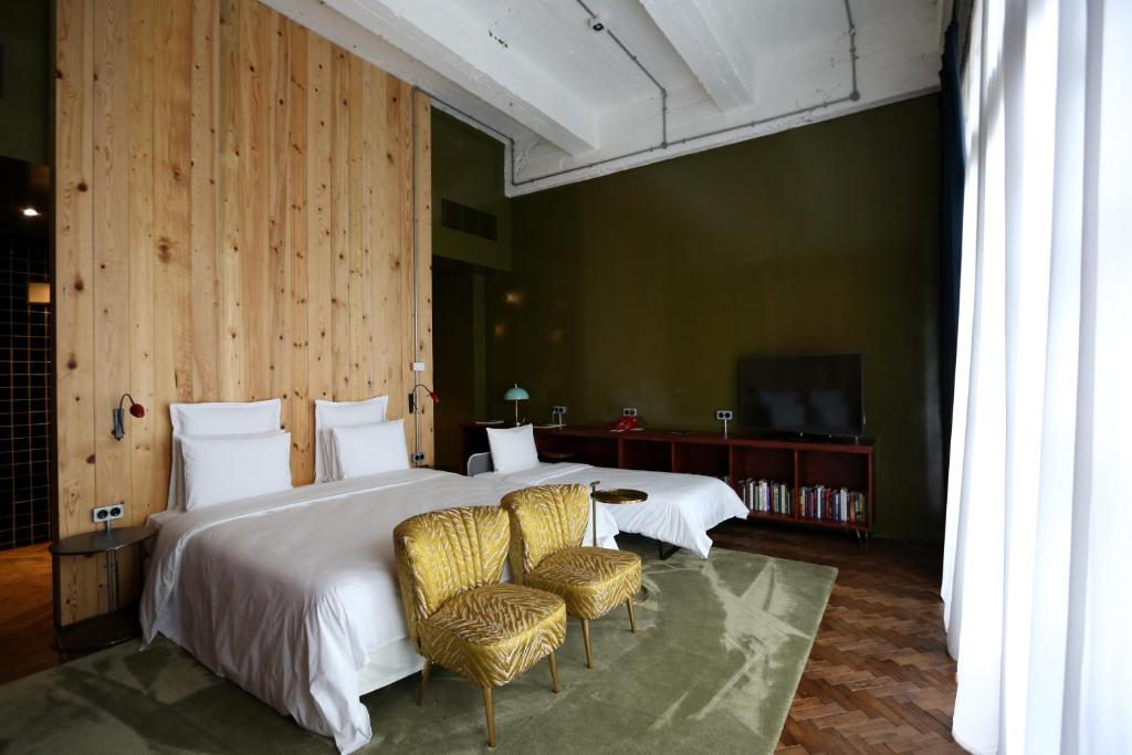 Postel nebo postele na pokoji v ubytování Stamba Hotel
