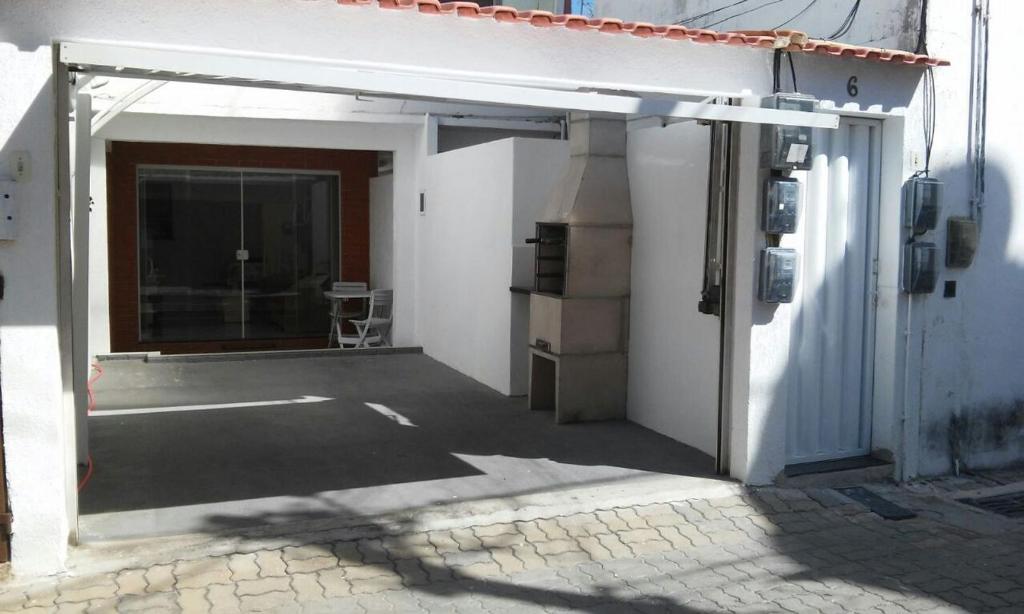 Casa com garagem e churrasqueira a 5 minutos da Praia Grande