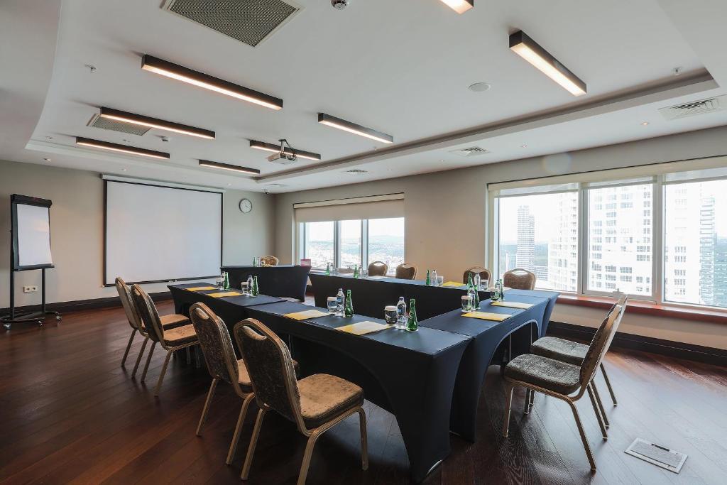 a meeting room with a long table and chairs at Crowne Plaza Istanbul Oryapark by IHG in Istanbul