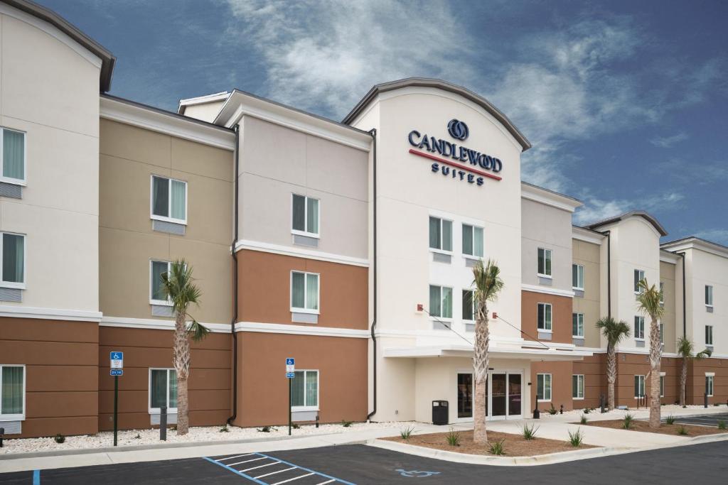 a rendering of the front of a cambridge hotel at Candlewood Suites - Ft Walton Bch - Hurlburt Area, an IHG Hotel in Fort Walton Beach