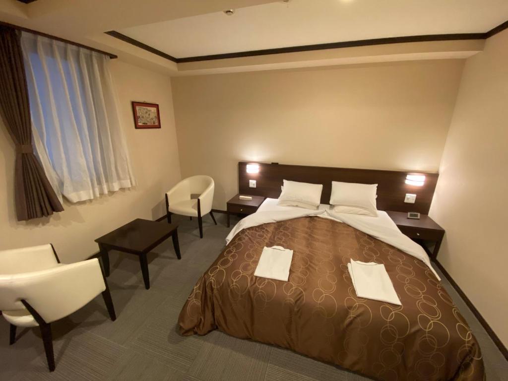 Postel nebo postele na pokoji v ubytování HOTEL SOSHA