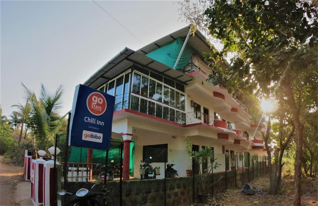 a building with a sign in front of it at Chill Inn Guest House in Anjuna