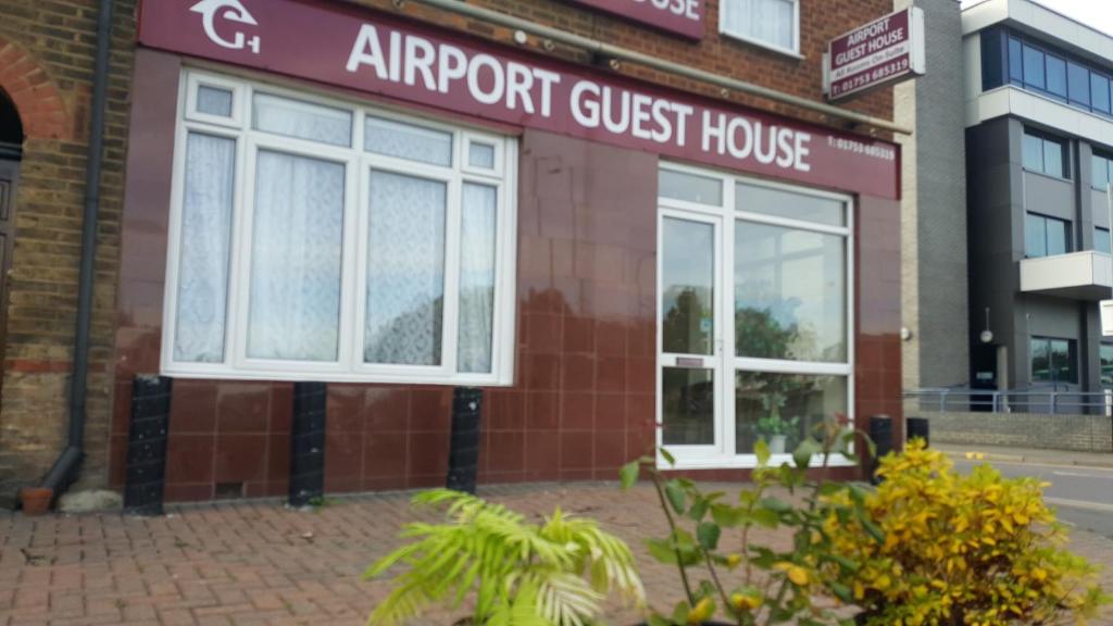 an apartment guest house in a brick building at Airport Guest House in Slough