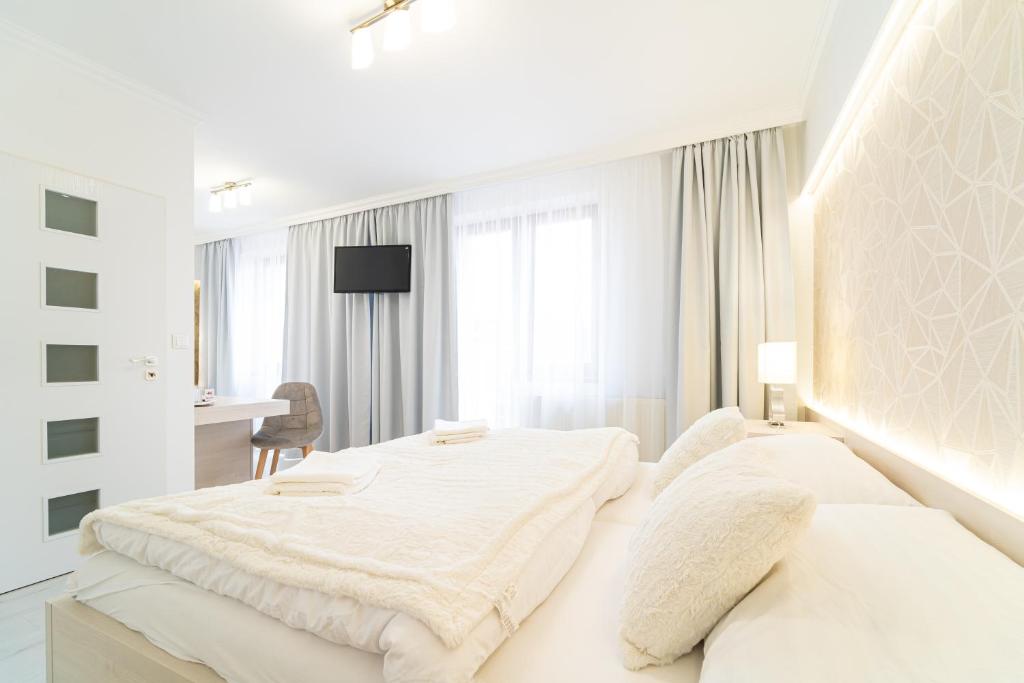 Postel nebo postele na pokoji v ubytování Hotel Artin