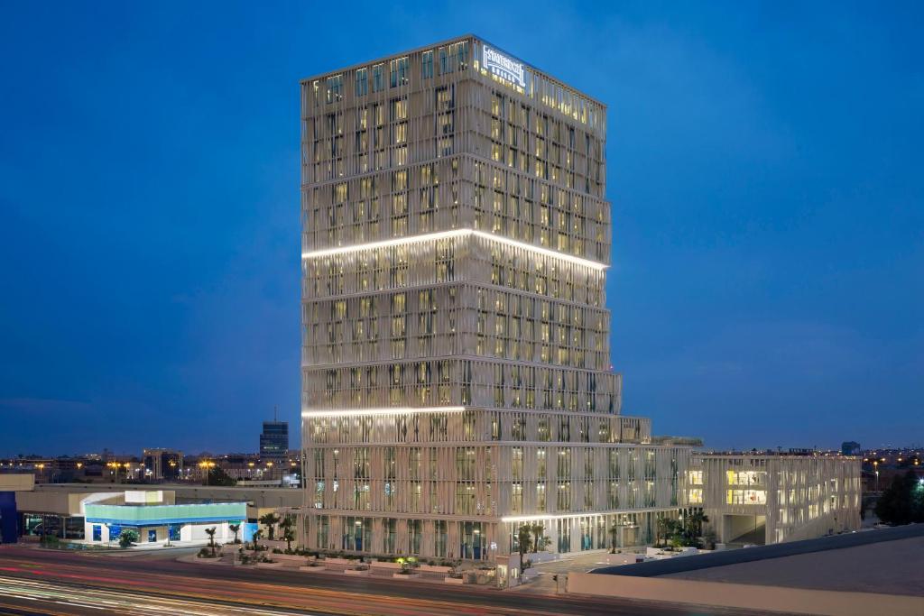 a tall building with lights on top of it at Staybridge Suites Al Khobar by IHG in Al Khobar