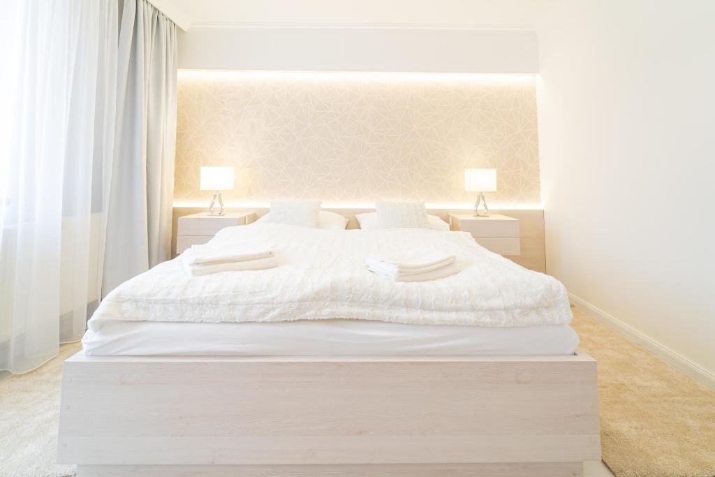 Postel nebo postele na pokoji v ubytování Hotel Artin
