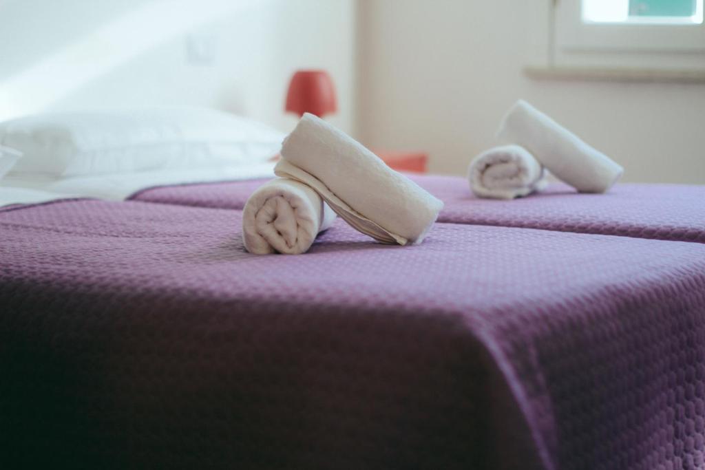 Łóżko lub łóżka w pokoju w obiekcie Agriturismo Beatilla