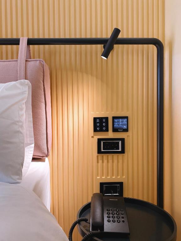 Postel nebo postele na pokoji v ubytování Iliria Boutique Hotel