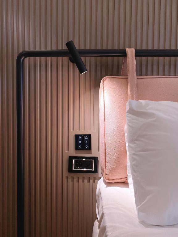 Postel nebo postele na pokoji v ubytování Iliria Boutique Hotel