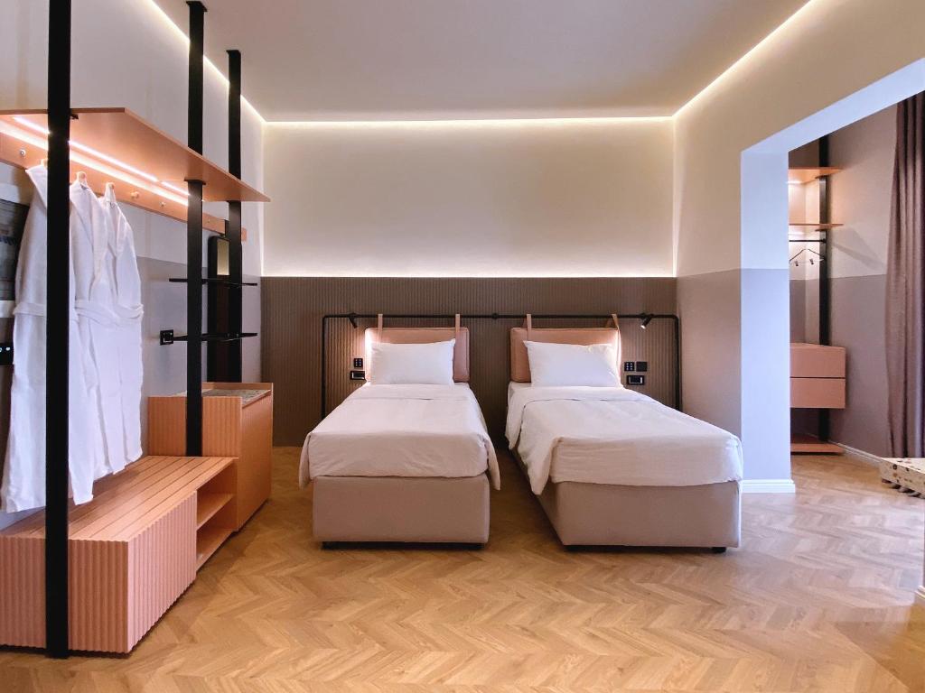 Postel nebo postele na pokoji v ubytování Iliria Boutique Hotel