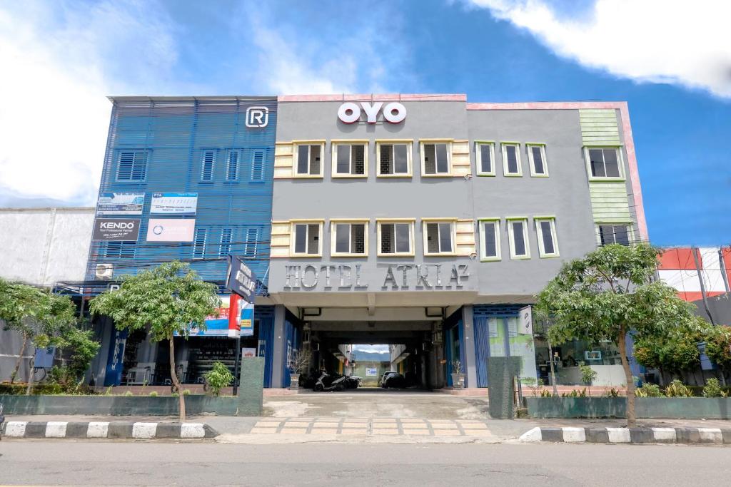 a building with a hotel entrance in a city at OYO Life 2966 Hotel Atriaz in Trenggalek
