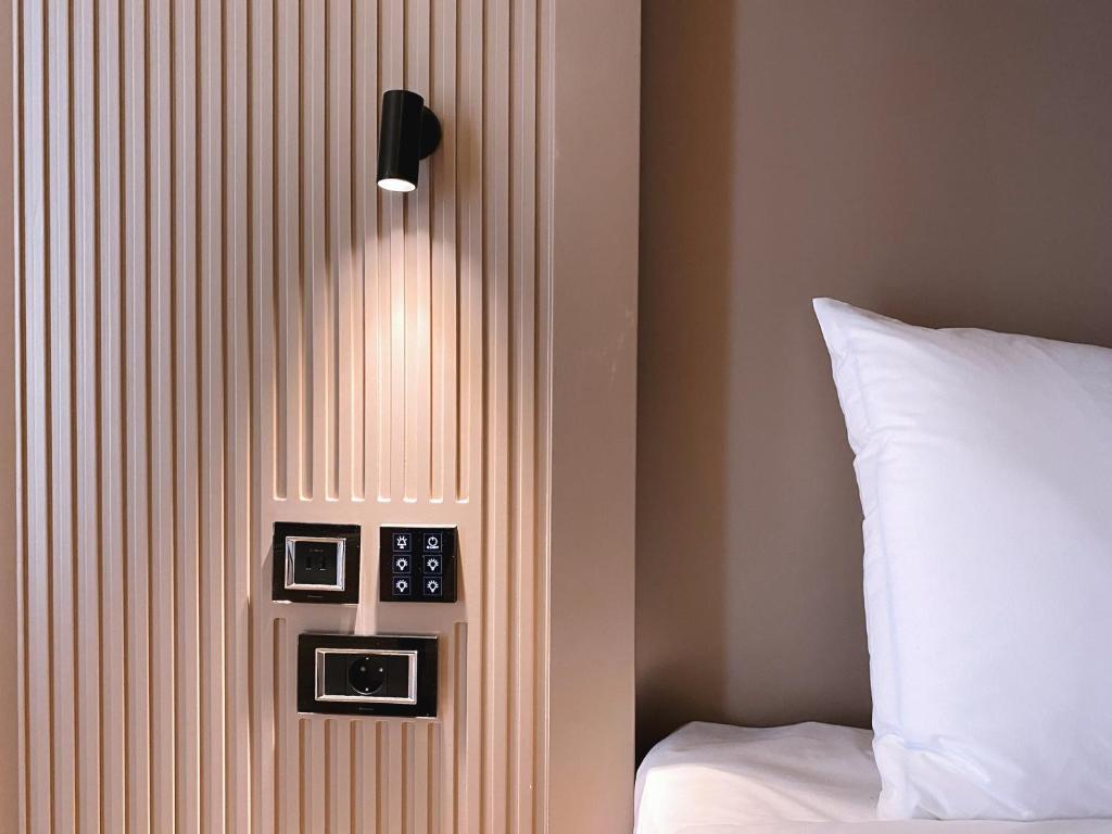 Postel nebo postele na pokoji v ubytování Iliria Boutique Hotel