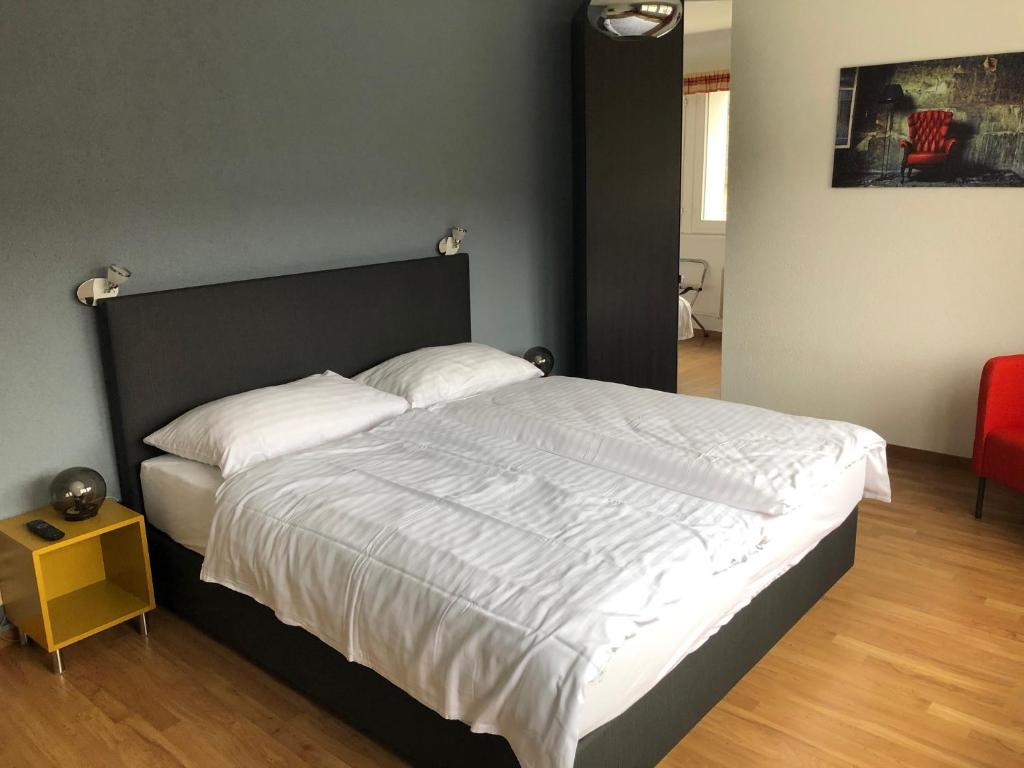 Postel nebo postele na pokoji v ubytování Hotel Les Rives Du Doubs