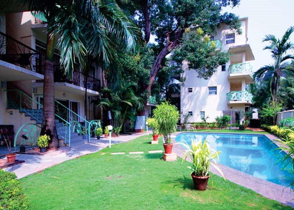 Πισίνα στο ή κοντά στο Sharanam Green Resort