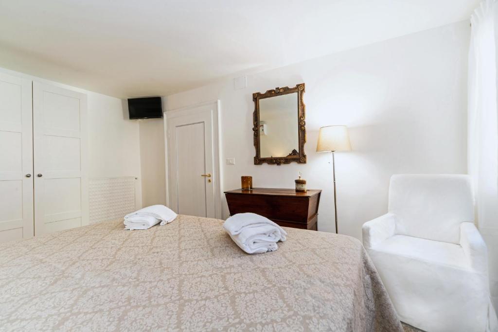 A bed or beds in a room at Ca' Terrazza di Marco Polo