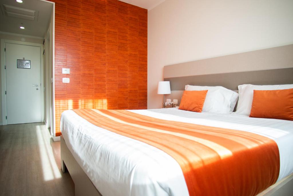 Postel nebo postele na pokoji v ubytování Hotel Glis