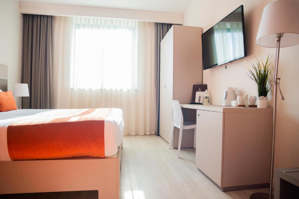 Postel nebo postele na pokoji v ubytování Hotel Glis