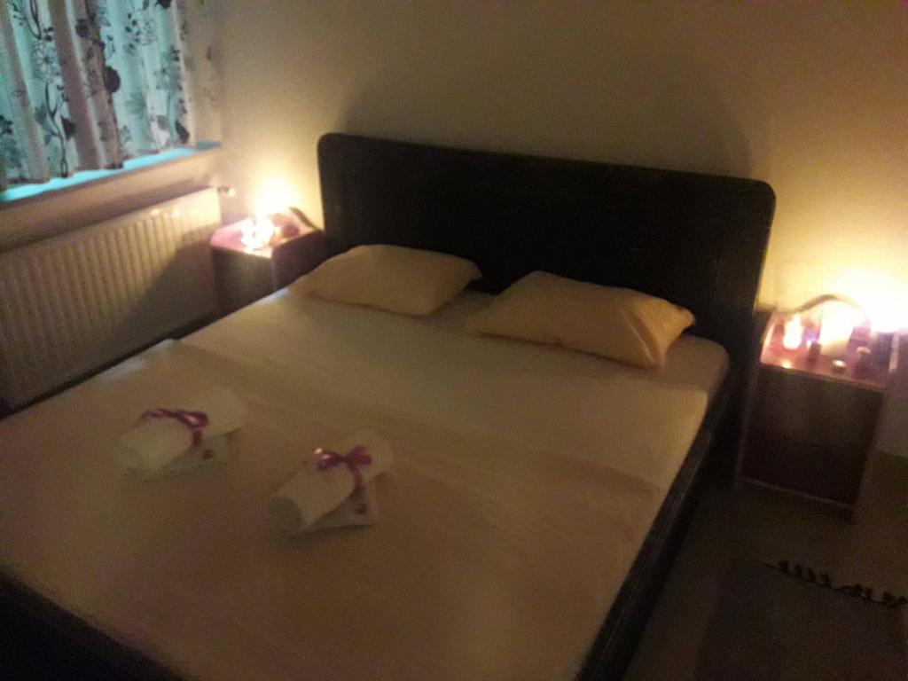 Posteľ alebo postele v izbe v ubytovaní Zorić Apartments & Rooms