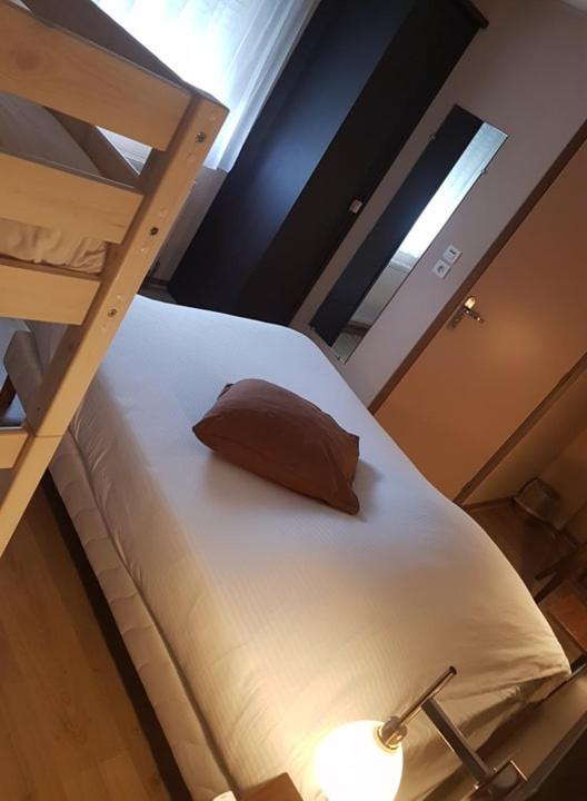 Postel nebo postele na pokoji v ubytování Ambiance Hotel