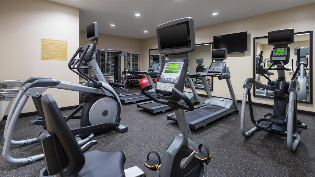 a gym with treadmills and elliptical machines at Candlewood Suites Grove City - Outlet Center, an IHG Hotel in Grove City