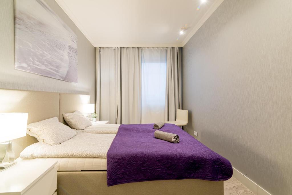 Posteľ alebo postele v izbe v ubytovaní Apartment Szafarnia 5