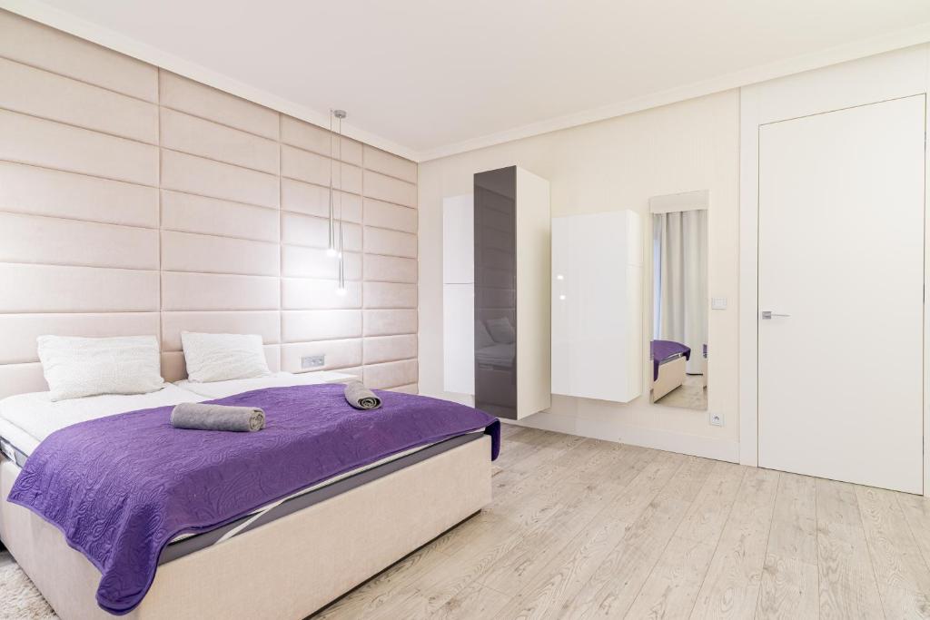 Posteľ alebo postele v izbe v ubytovaní Apartment Szafarnia 5