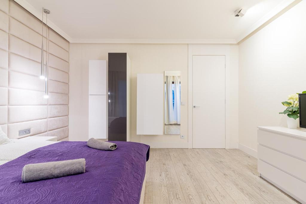 Posteľ alebo postele v izbe v ubytovaní Apartment Szafarnia 5