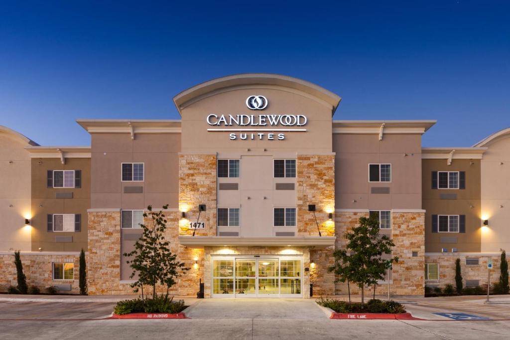 a rendering of the front of a hotel with a camelot suites sign at Candlewood Suites New Braunfels, an IHG Hotel in New Braunfels