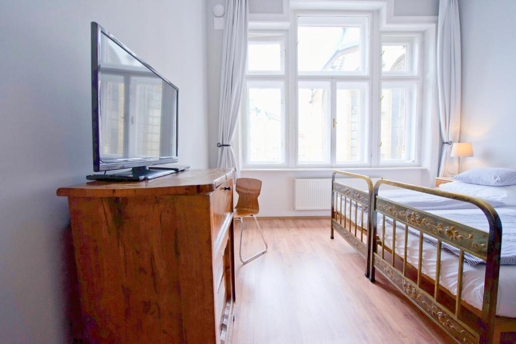 Posteľ alebo postele v izbe v ubytovaní Jacob Brno Apartments