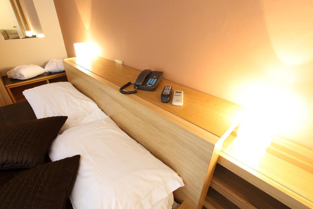 Postel nebo postele na pokoji v ubytování Hotel Del Viale