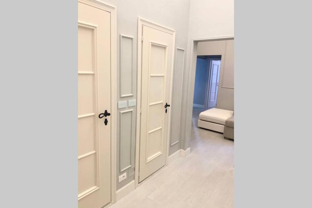 Łóżko lub łóżka w pokoju w obiekcie Suite Nico Bologna Centro