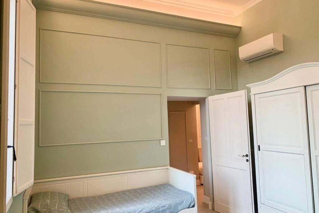 Łóżko lub łóżka w pokoju w obiekcie Suite Nico Bologna Centro