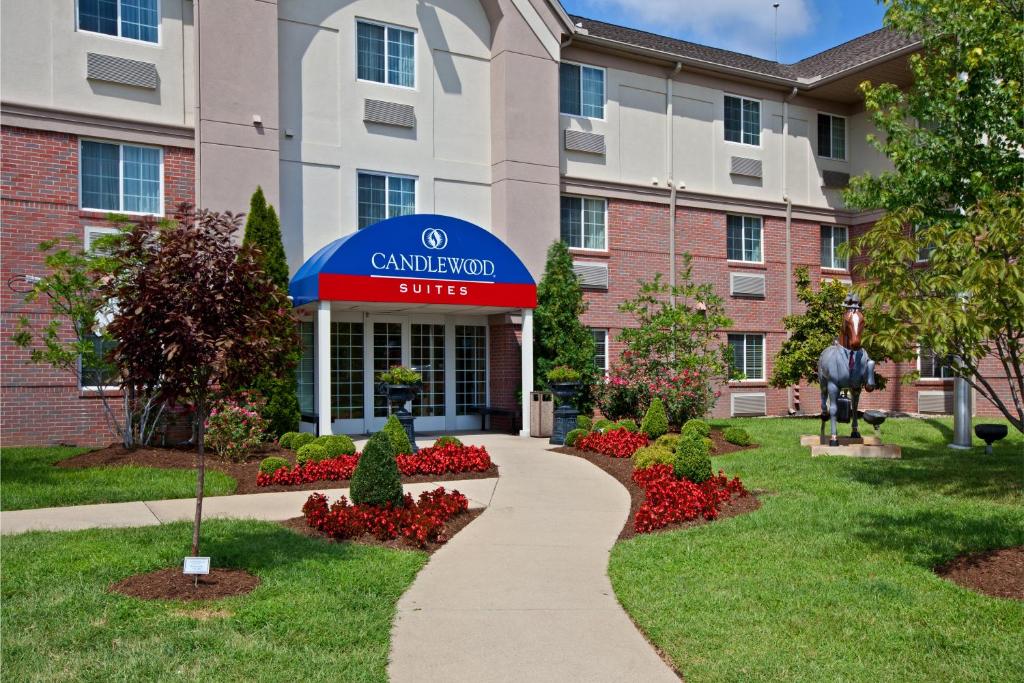 a building with a walkway outside of a campus at Candlewood Suites Louisville Airport, an IHG Hotel in Louisville