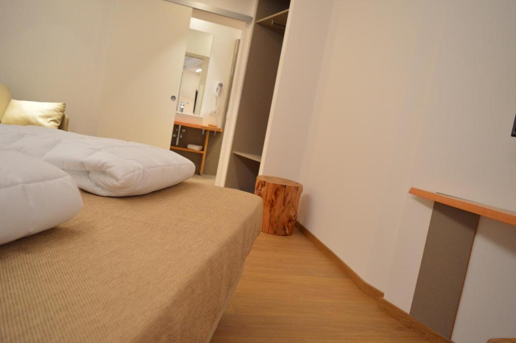 Postel nebo postele na pokoji v ubytování Agriturismo Terre di Ginepro
