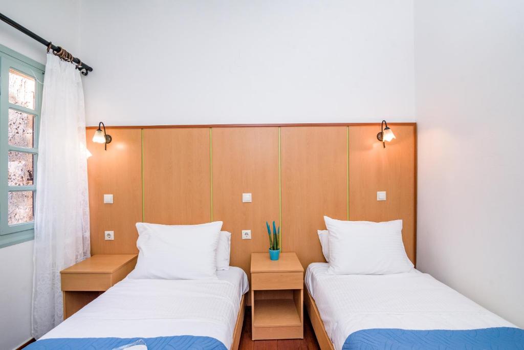 Postel nebo postele na pokoji v ubytování Alegria Pension