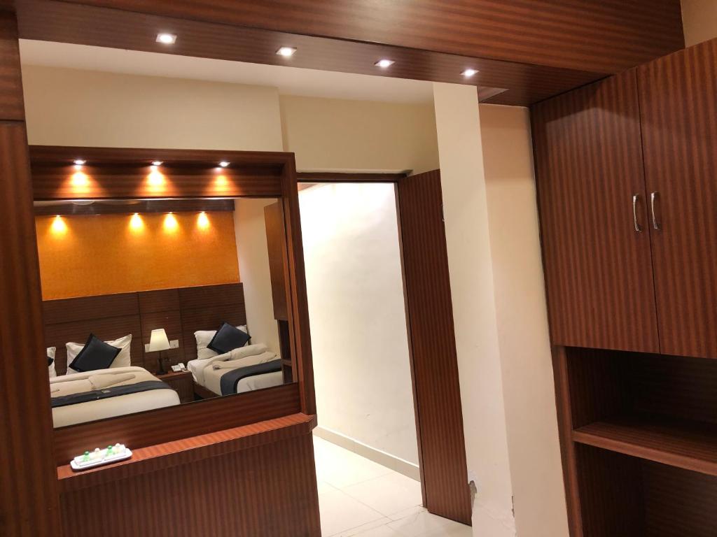 Postel nebo postele na pokoji v ubytování HOTEL SPARK RESIDENCY