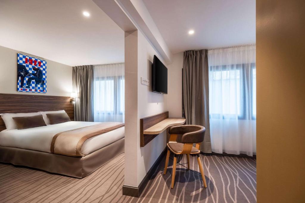 Postel nebo postele na pokoji v ubytování Quality Hotel Toulouse Centre