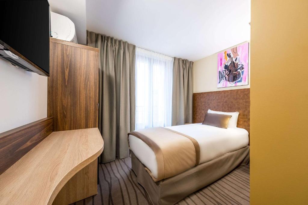 Postel nebo postele na pokoji v ubytování Quality Hotel Toulouse Centre