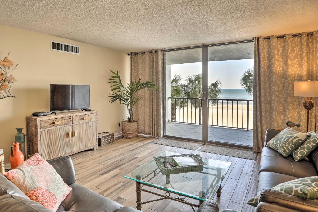 a living room with a view of the ocean at Chic Myrtle Beach Seaside Escape with Pool Access! in Myrtle Beach