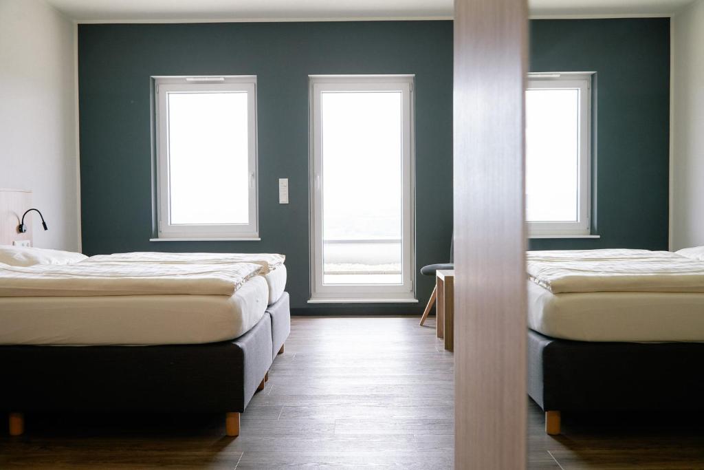Postel nebo postele na pokoji v ubytování FETZ DAS LORELEY HOTEL