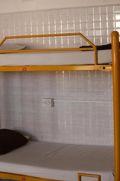 Postel nebo postele na pokoji v ubytování vrs dormitary