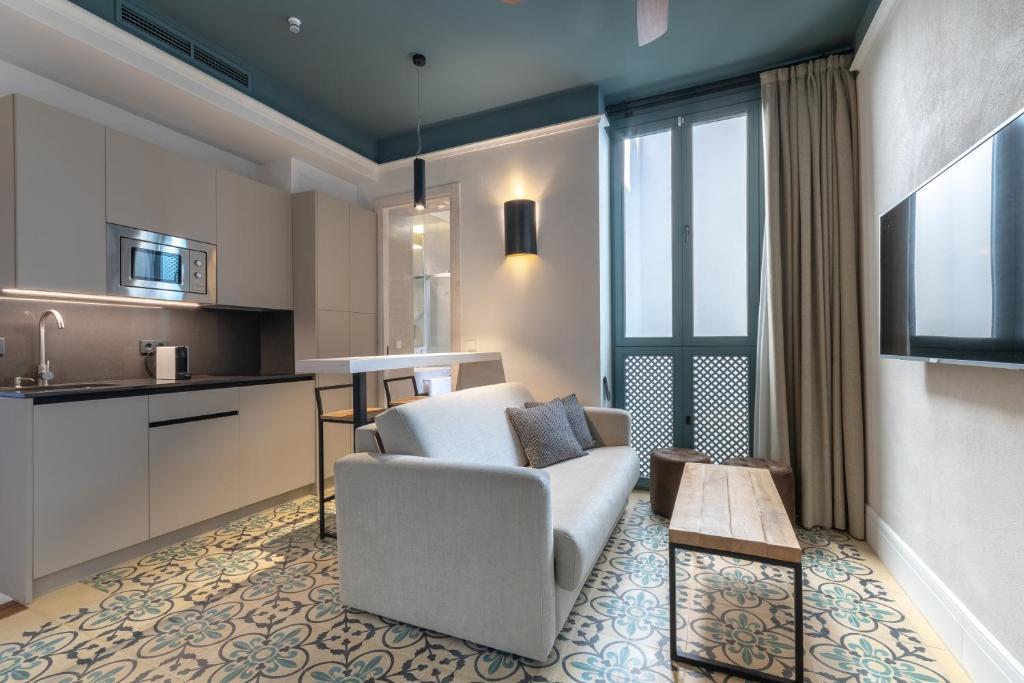 Televízia a/alebo spoločenská miestnosť v ubytovaní Apartamentos Caminante del Agua