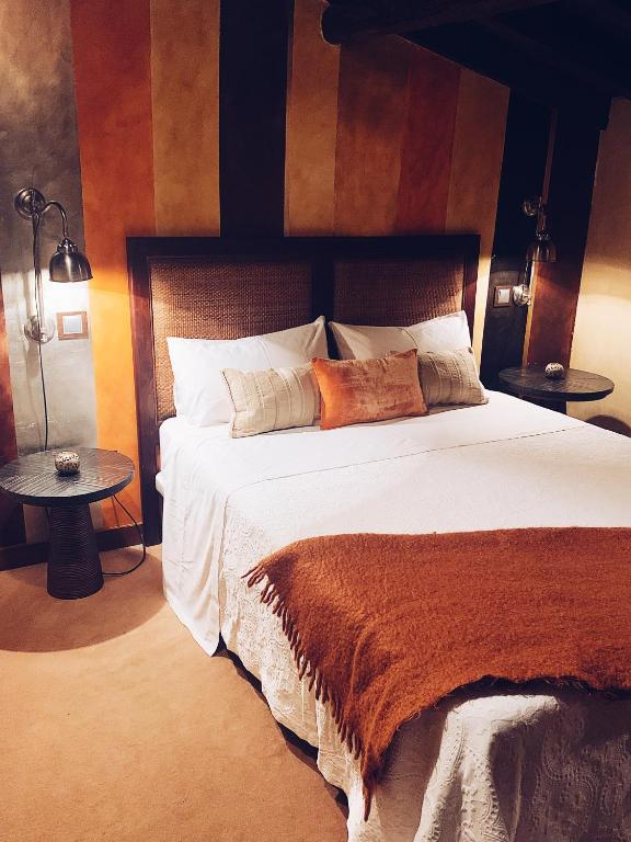 Postel nebo postele na pokoji v ubytování Hotel Boutique Valle de Oca