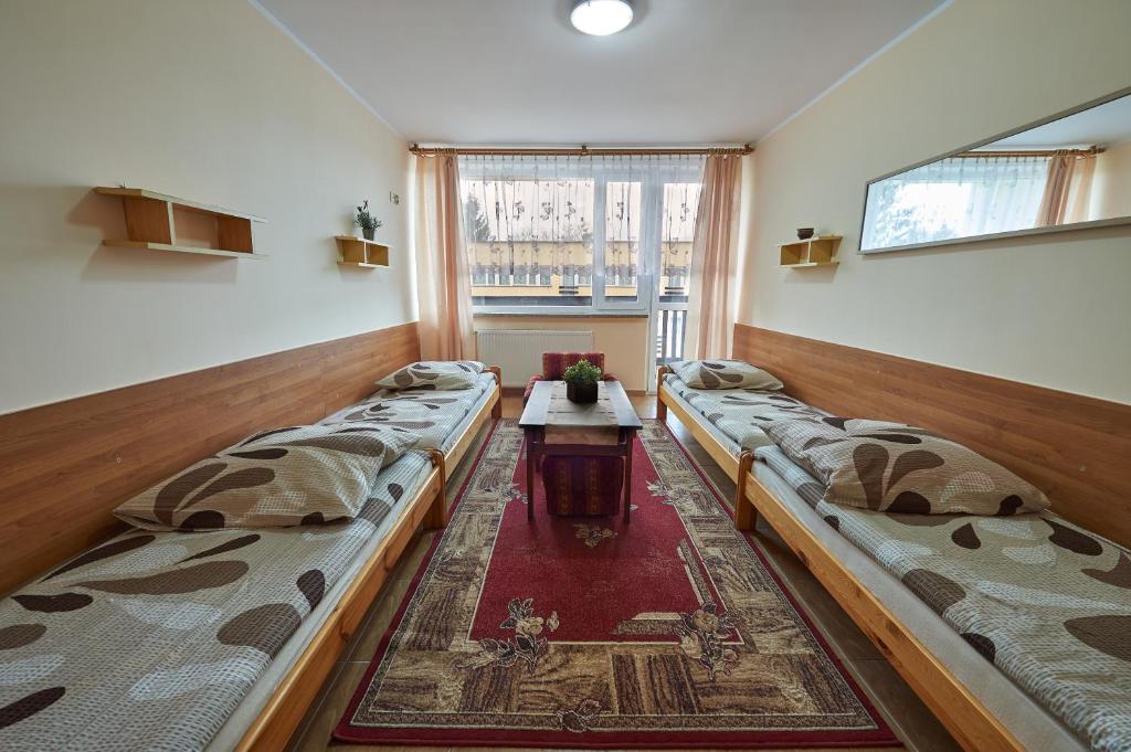 Postel nebo postele na pokoji v ubytování OW Mikomania