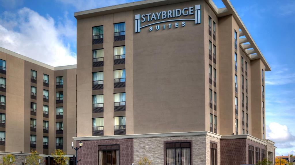 a building with a sign on the side of it at Staybridge Suites Hamilton - Downtown, an IHG Hotel in Hamilton