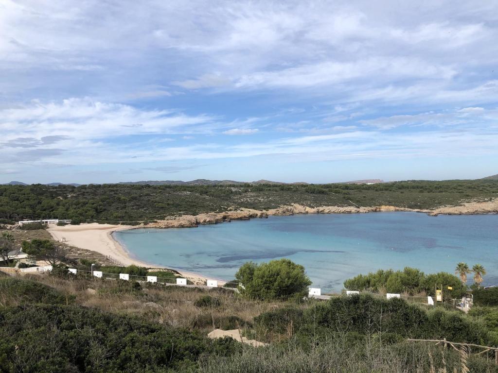 a view of a beach and a body of water at Duplex Son Parc Vistas Costa Norte in Es Mercadal