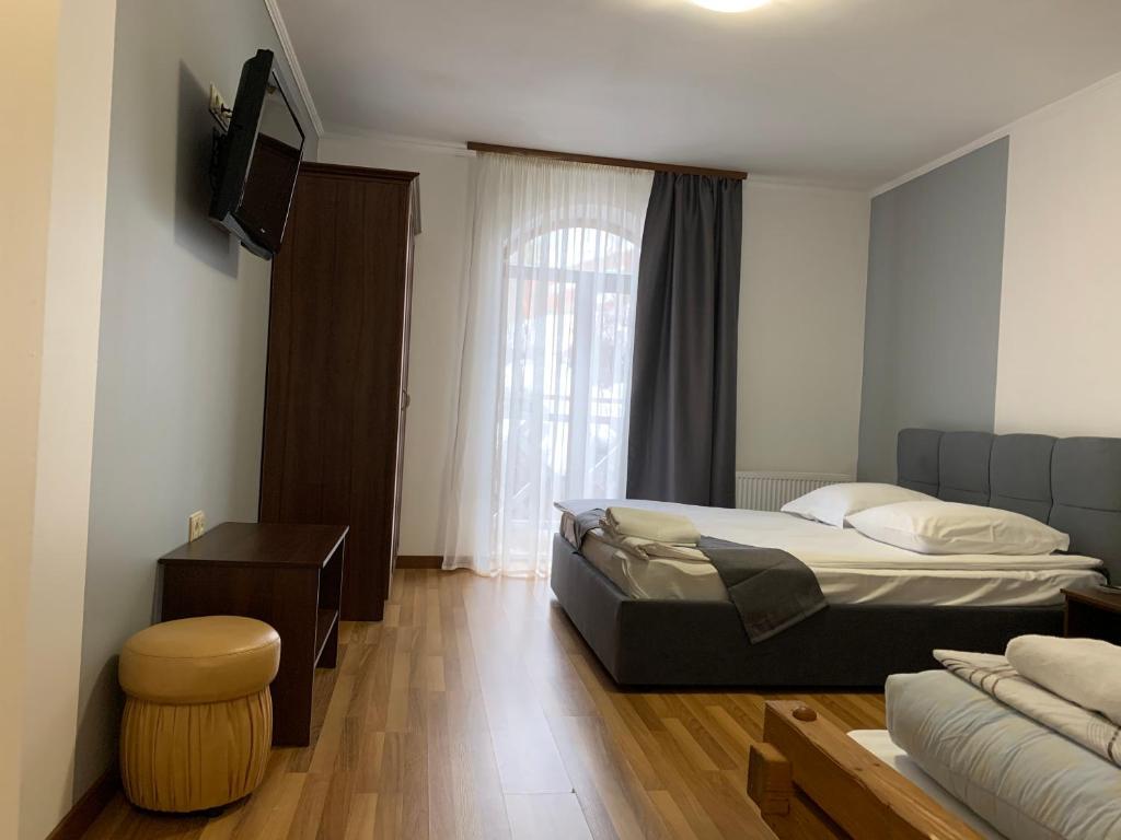 Postel nebo postele na pokoji v ubytování Hotel Kalyna