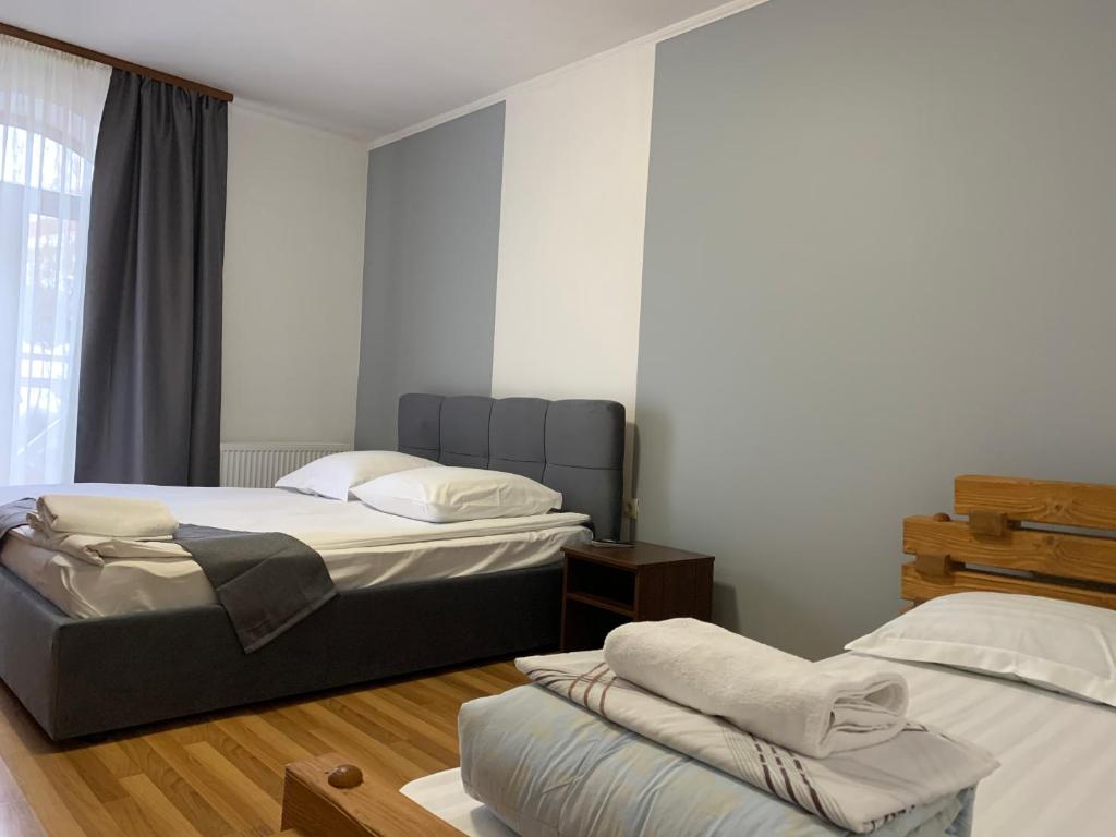 Postel nebo postele na pokoji v ubytování Hotel Kalyna